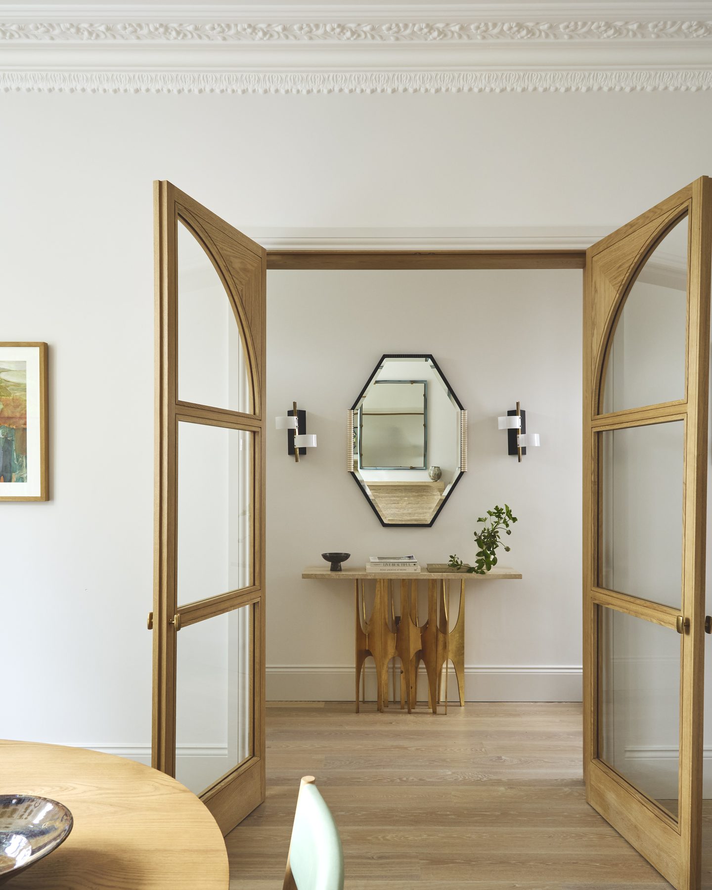Glazed oak double doors opening from the dining room into the hallway