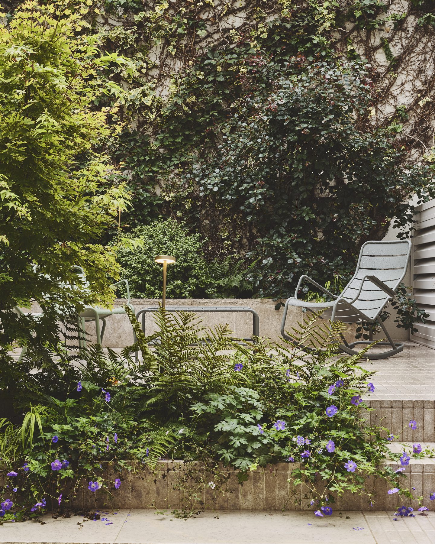 Garden with established trees and terrace seating