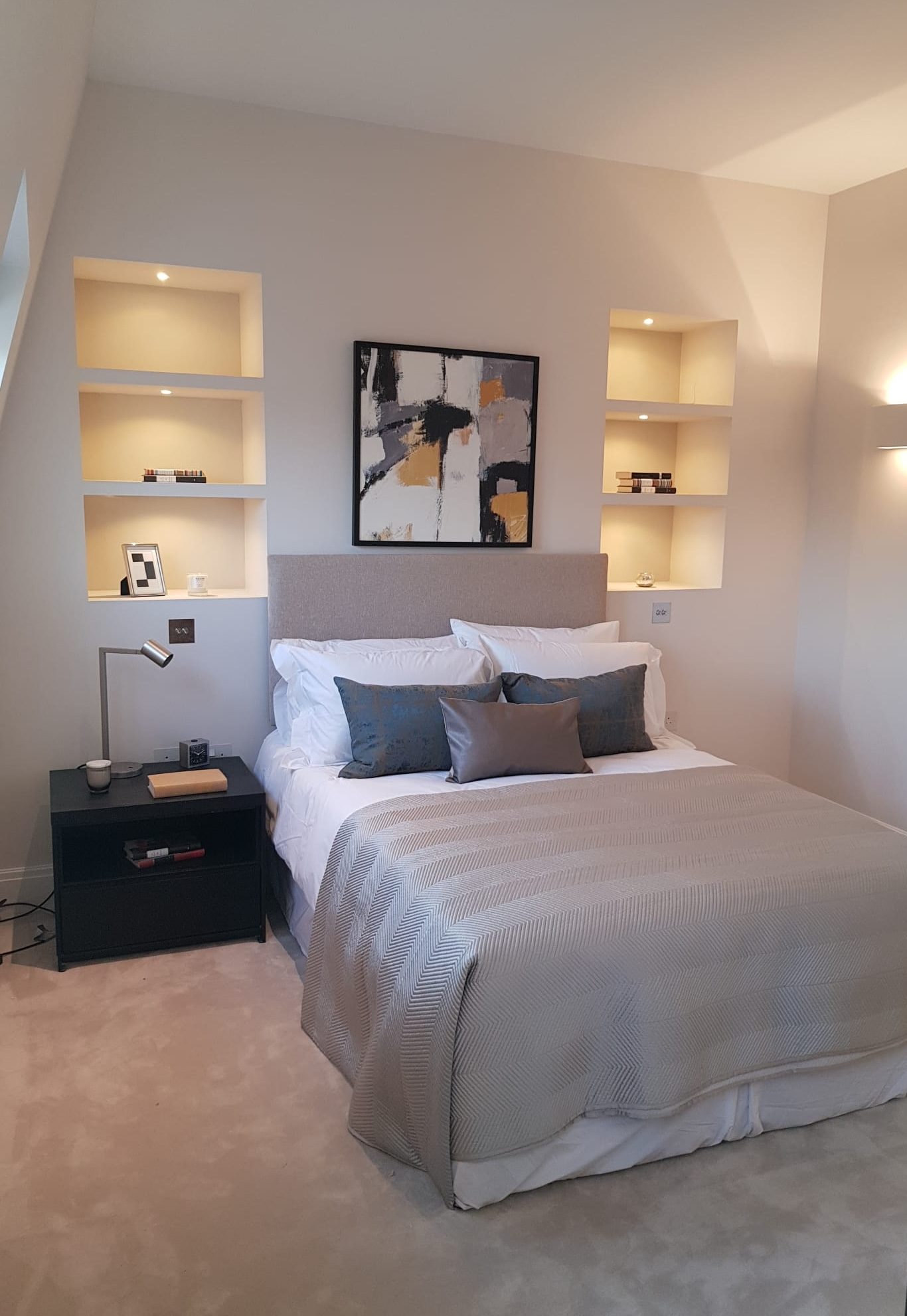 Bedroom with alcove shelving