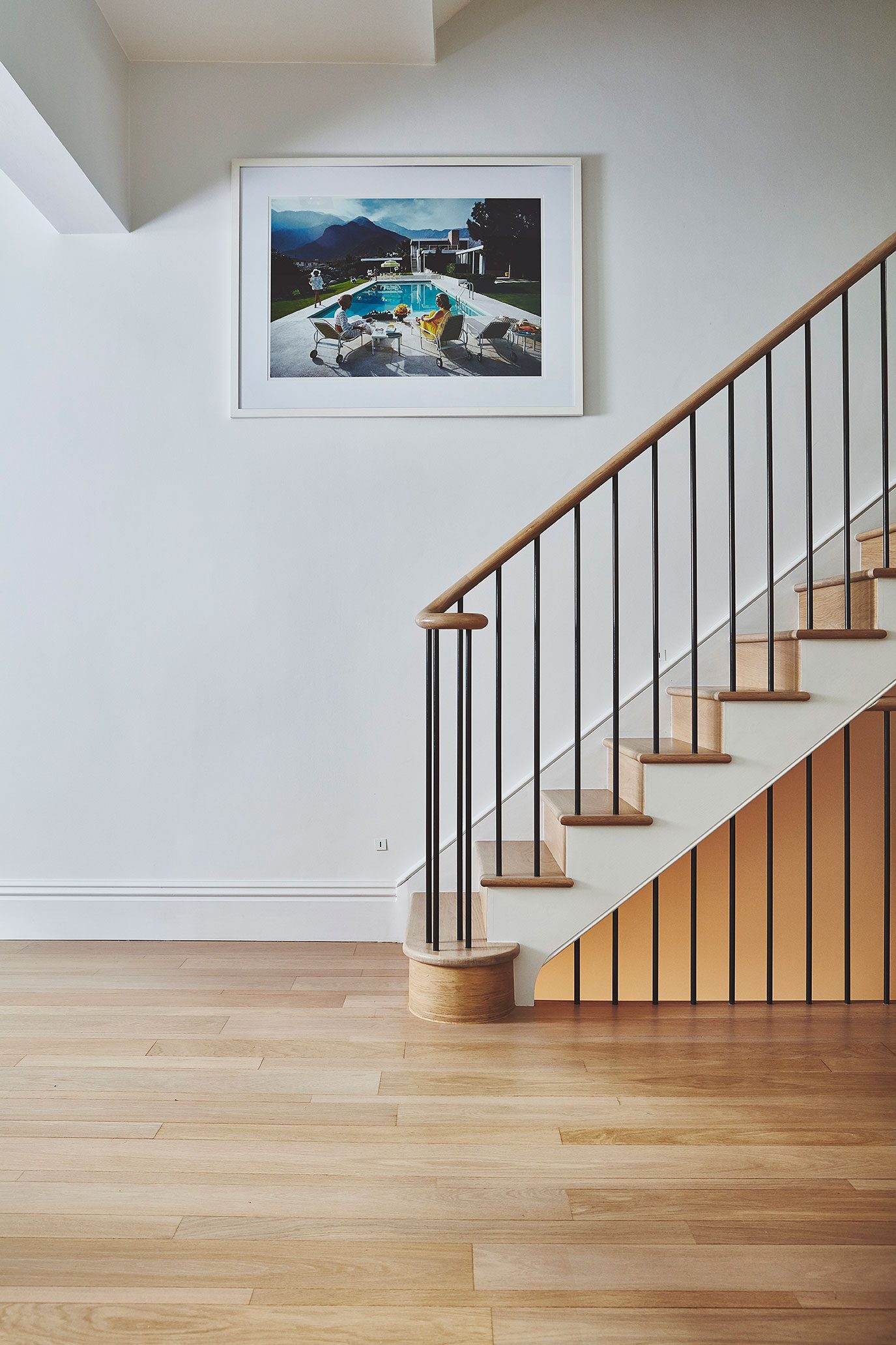 Staircase with oak treads and slim black balusters