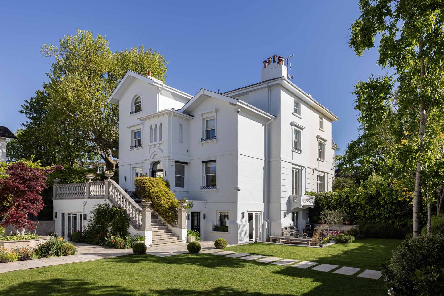 The white stucco villa seen from the garden
