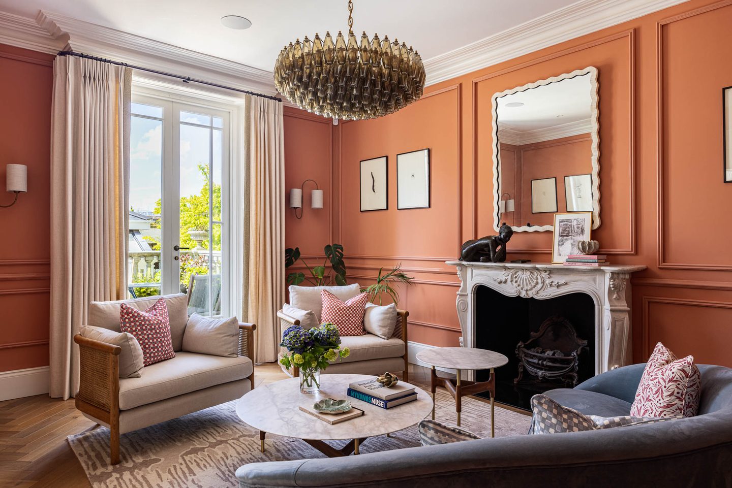 Drawing room with beaded chandelier and full-height windows to the garden