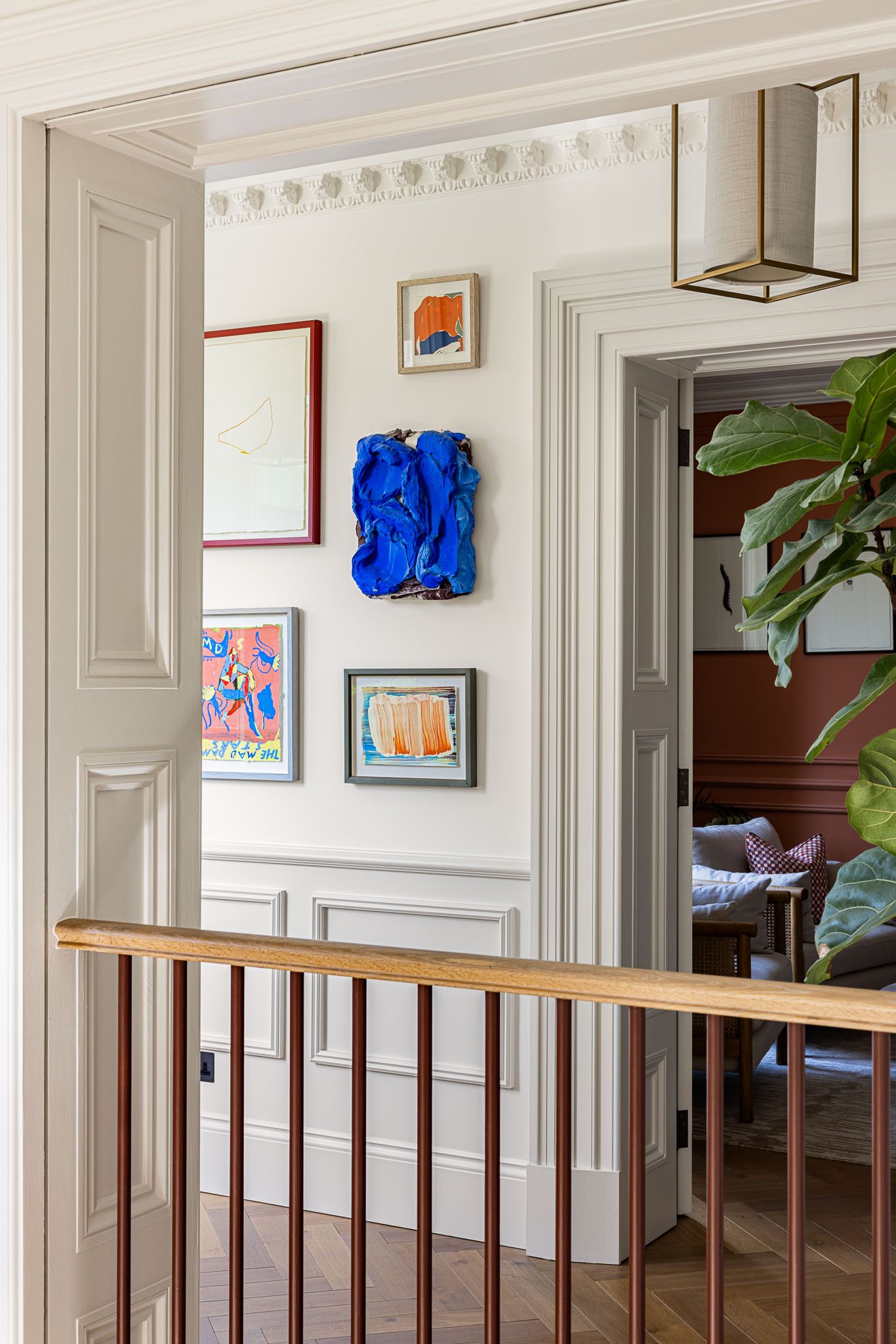Stair landing hung with artwork