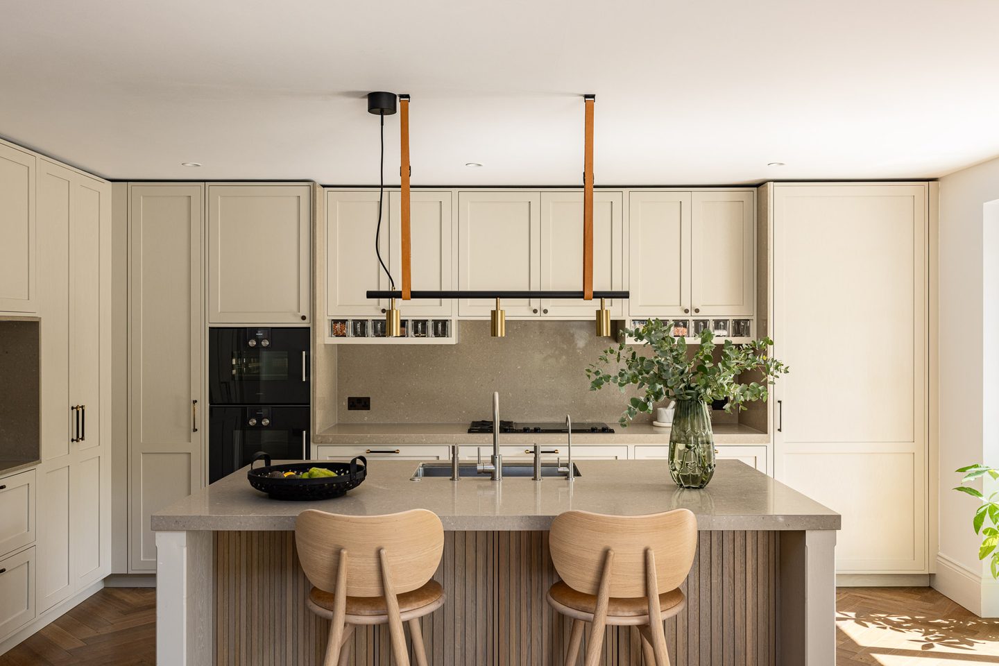 Kitchen with island and suspended lighting rail