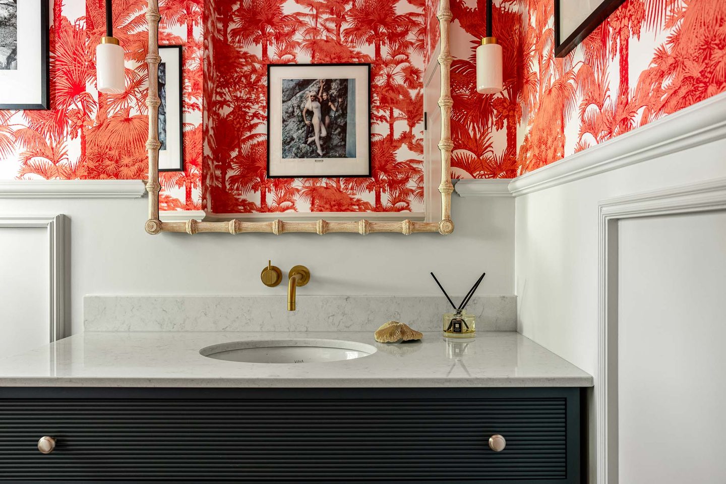 Cloakroom with toile wallpaper and dark fluted vanity
