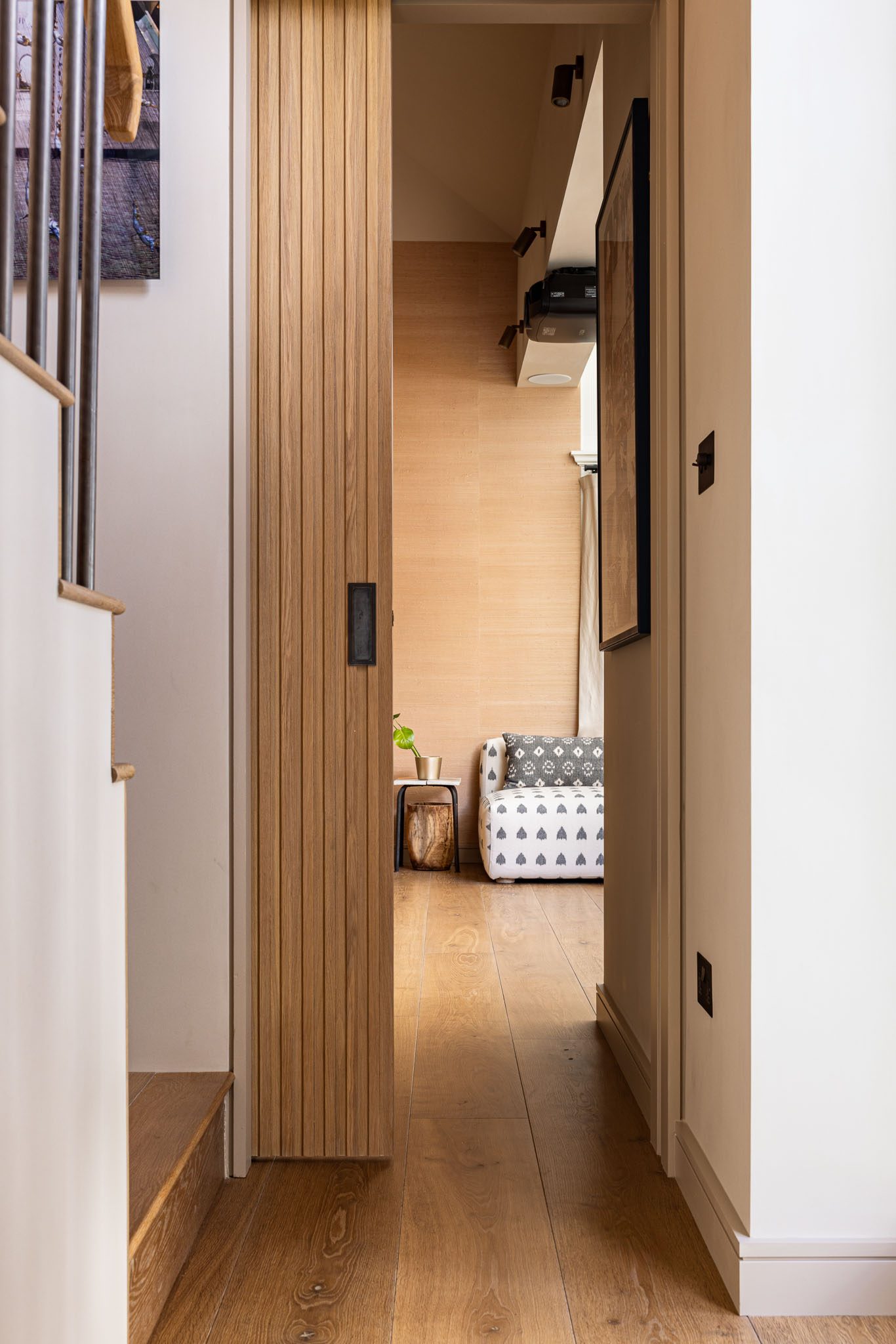 Corridor with slatted timber screen leading to the bedroom