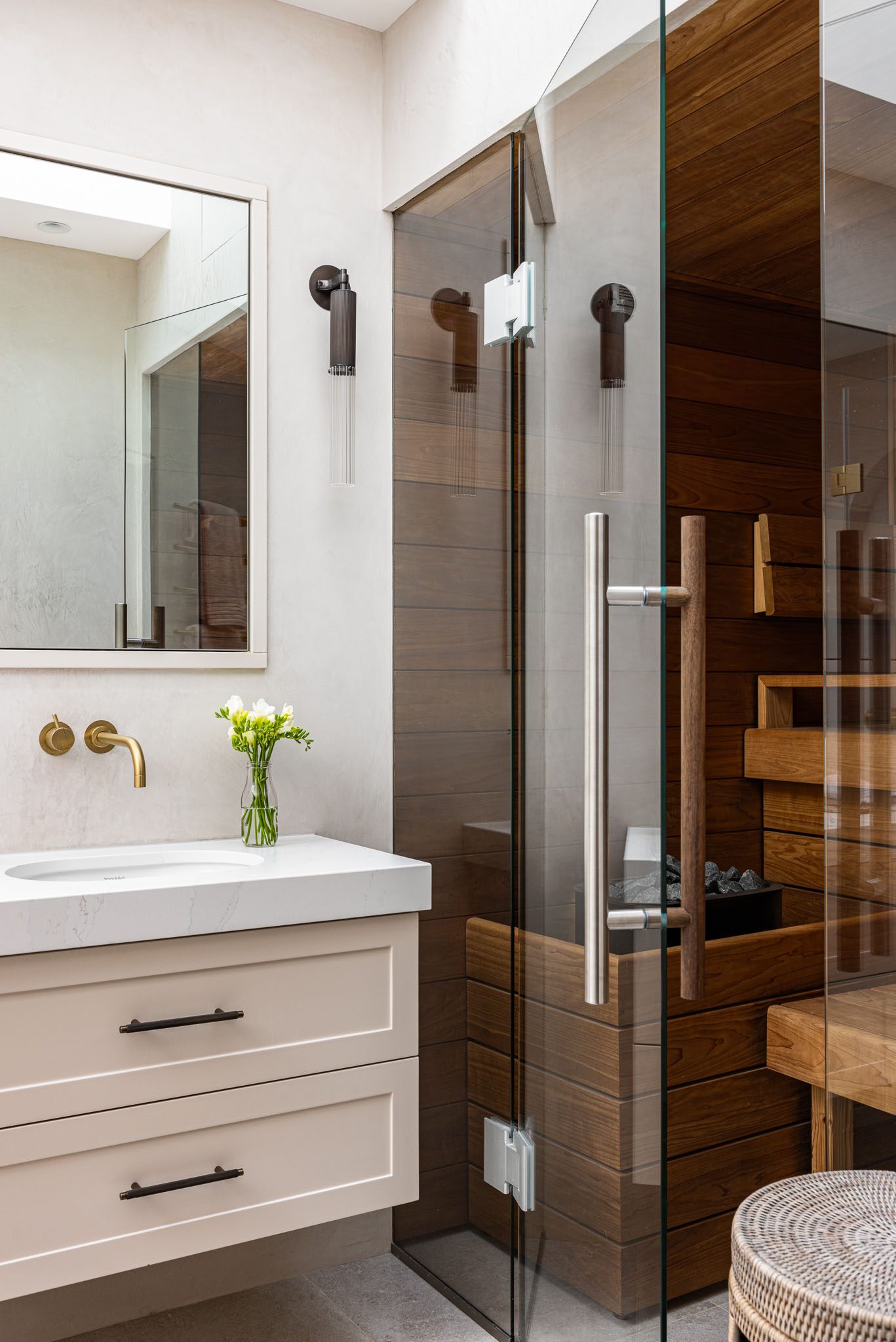 Shower room with sauna behind a glazed screen