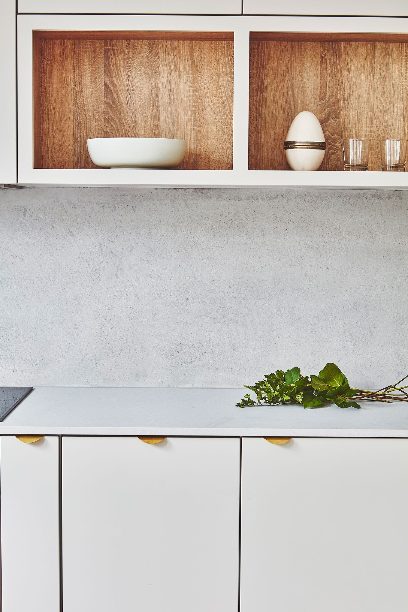 Kitchen detail with oak shelving above the worktop
