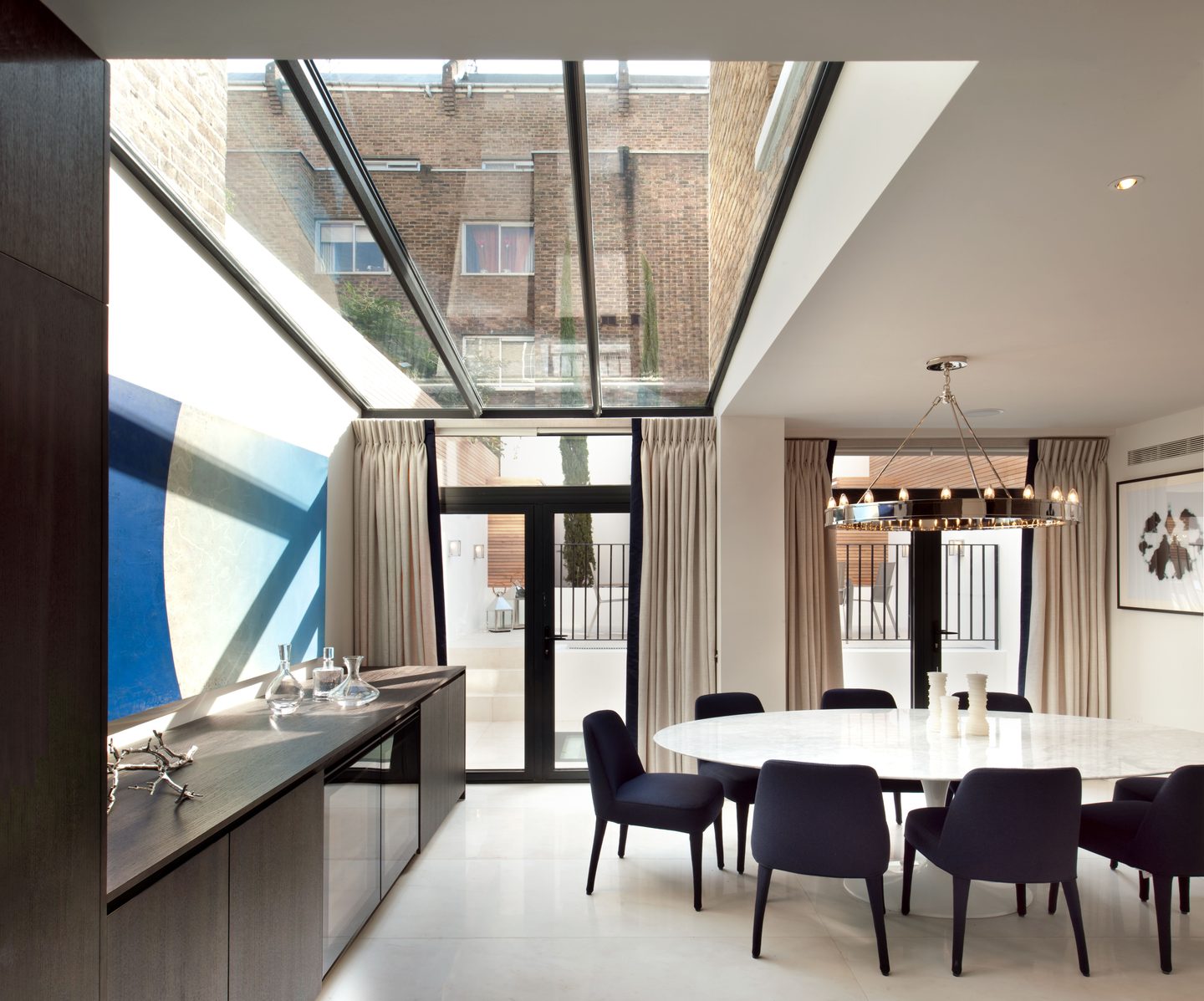 Dining area beneath a full-width rooflight