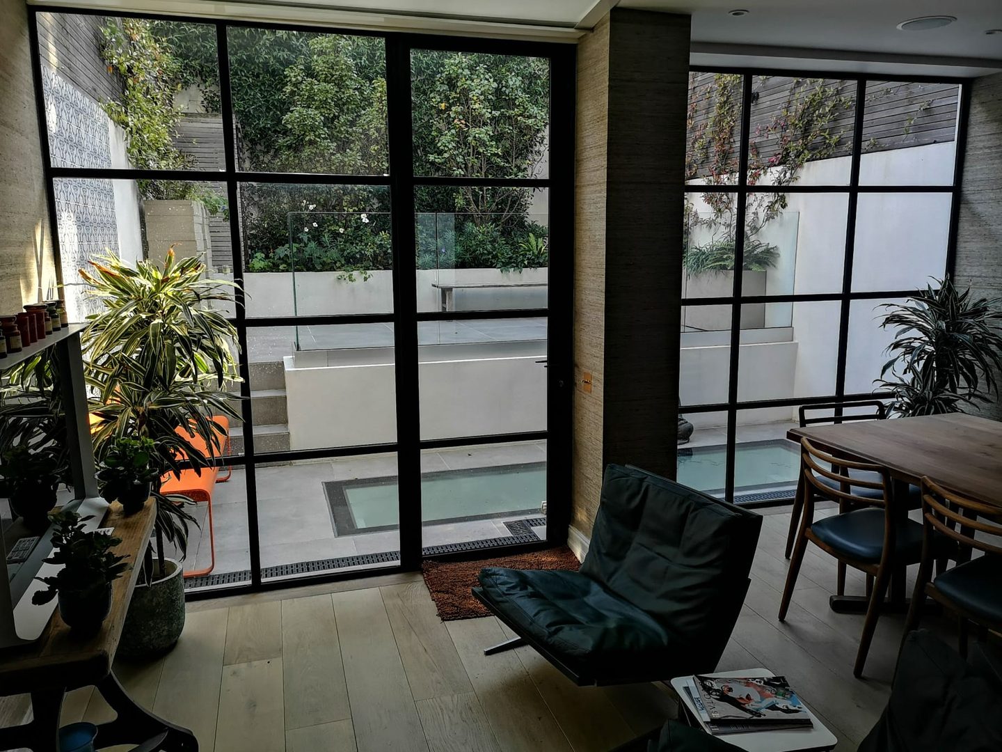 Garden room with steel-framed glazing opening to the terrace