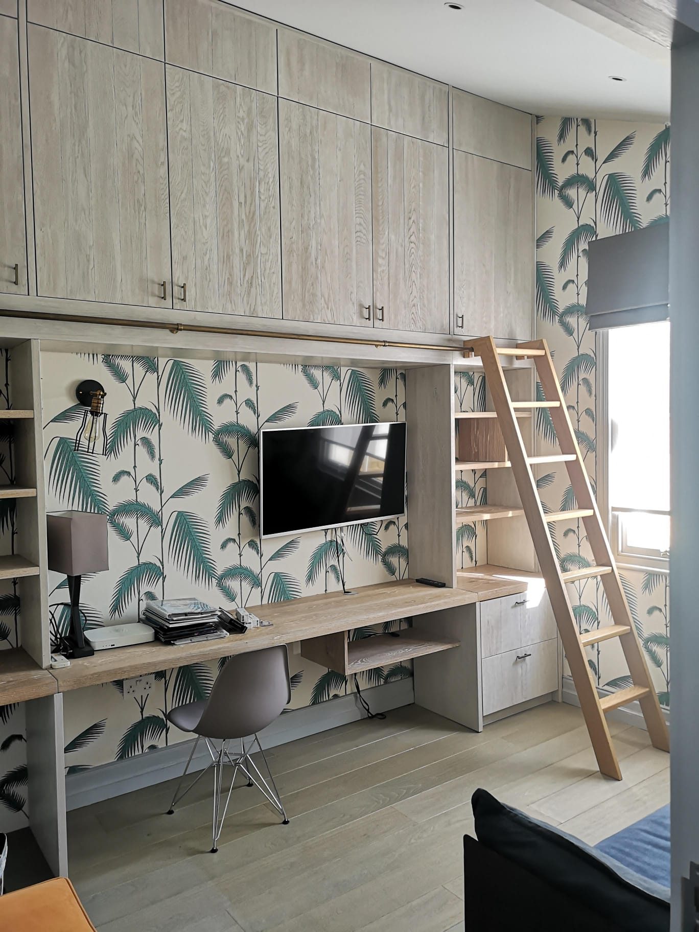 Study with fitted joinery and library ladder