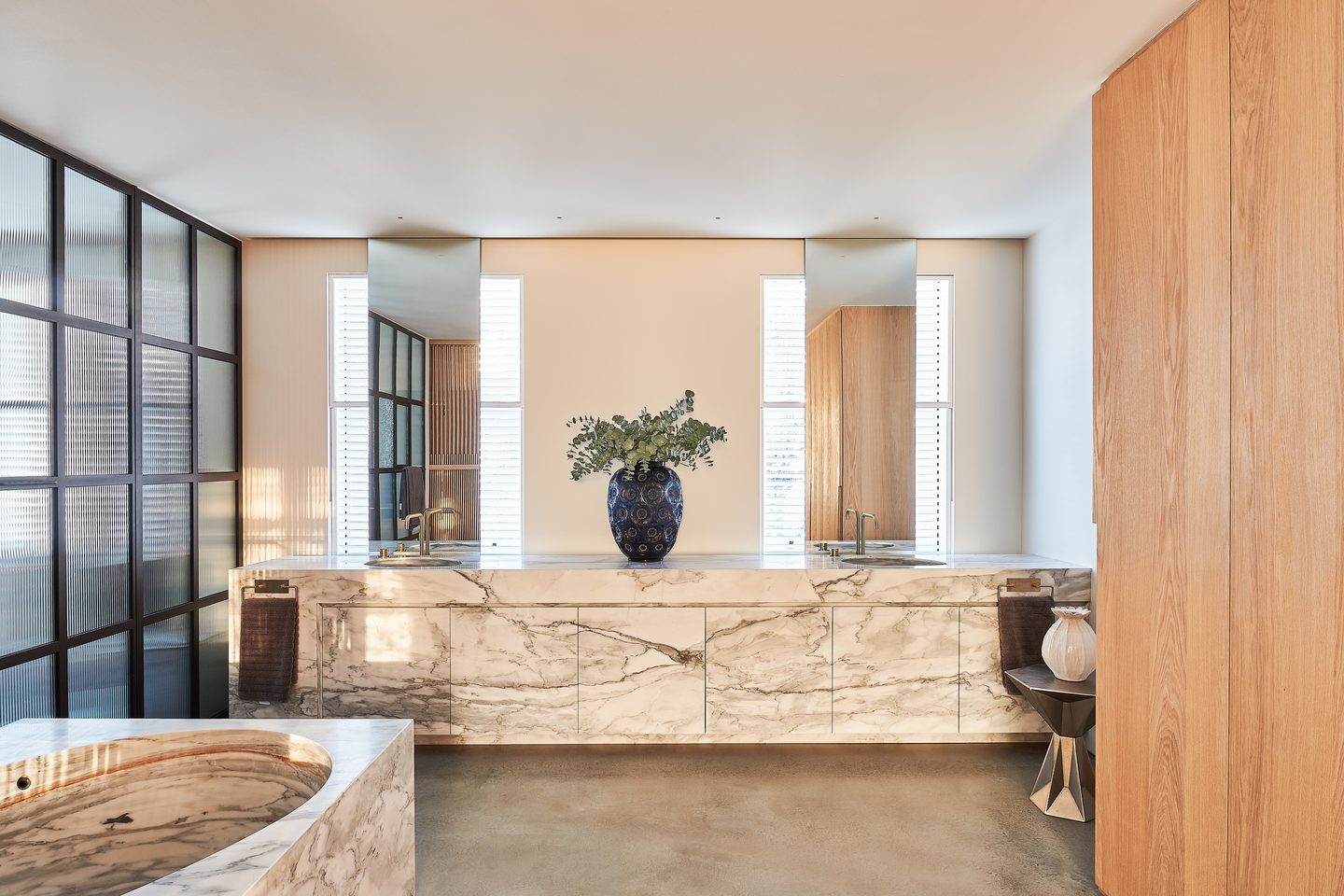 Bathroom with marble vanity running the length of the room