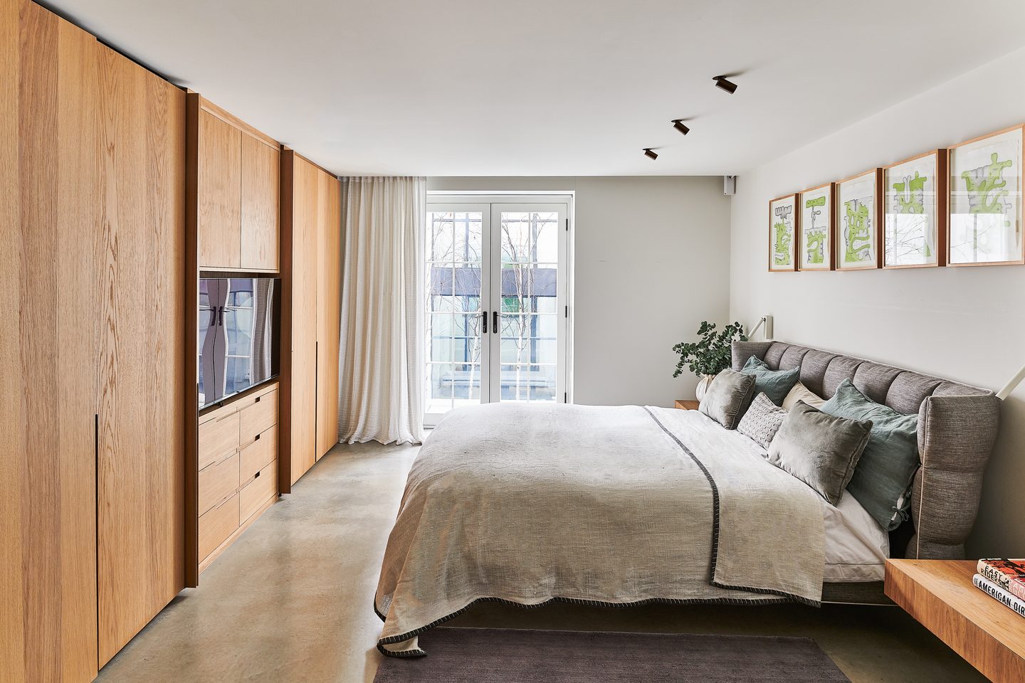 Bedroom with fitted oak wardrobes and doors to the terrace