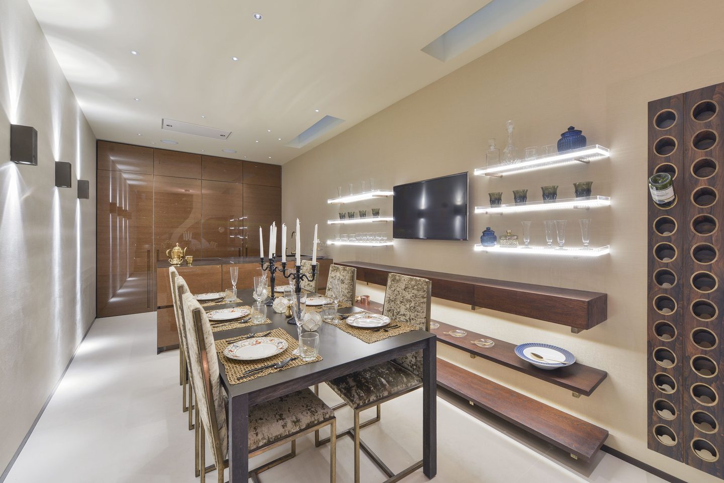 Dining room with backlit shelving and wine wall
