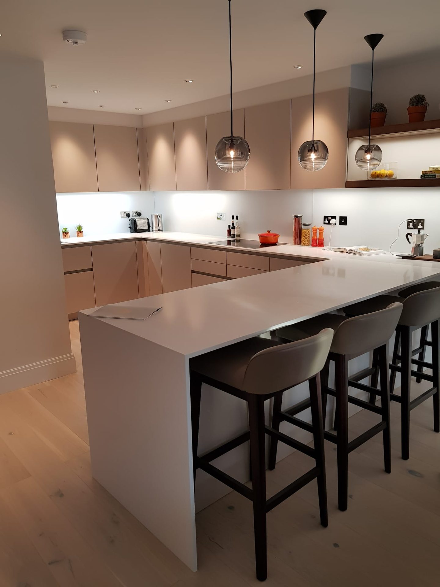 Kitchen with breakfast bar and pendant lighting